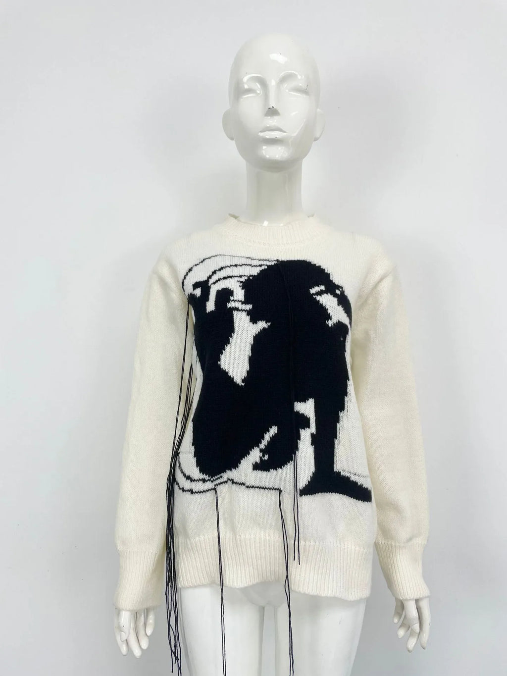 Women's loose grey alpaca wool pullover sweater with tassel detailing and round neck