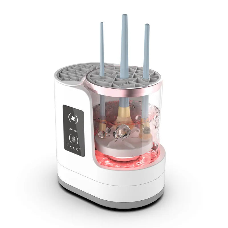 White rechargeable electric makeup brush cleaner with drying chamber on a vanity table.