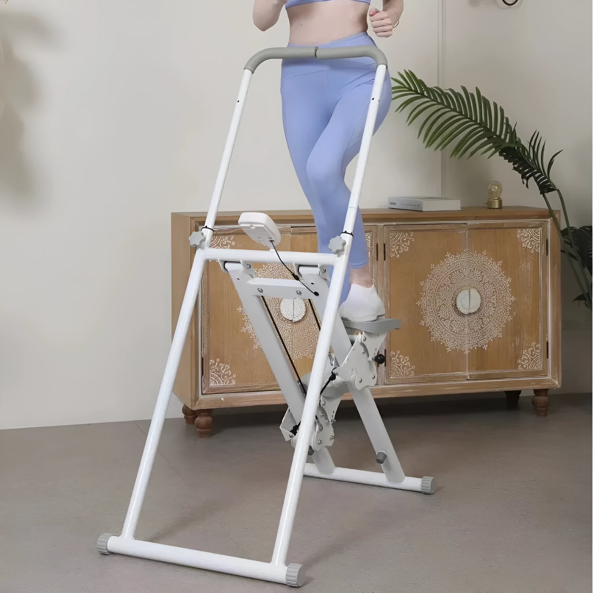 Foldable white multi-function treadmill with integrated indoor climbing frame for home gym.