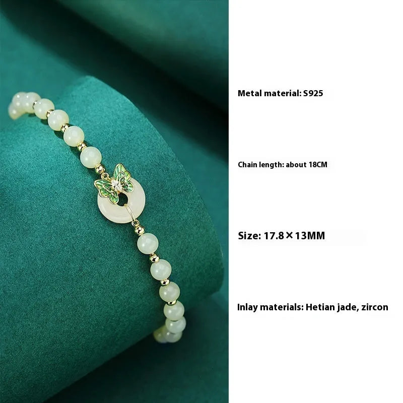 Cyan Hetian Jade bracelet with sterling silver butterfly design, 6mm beads.