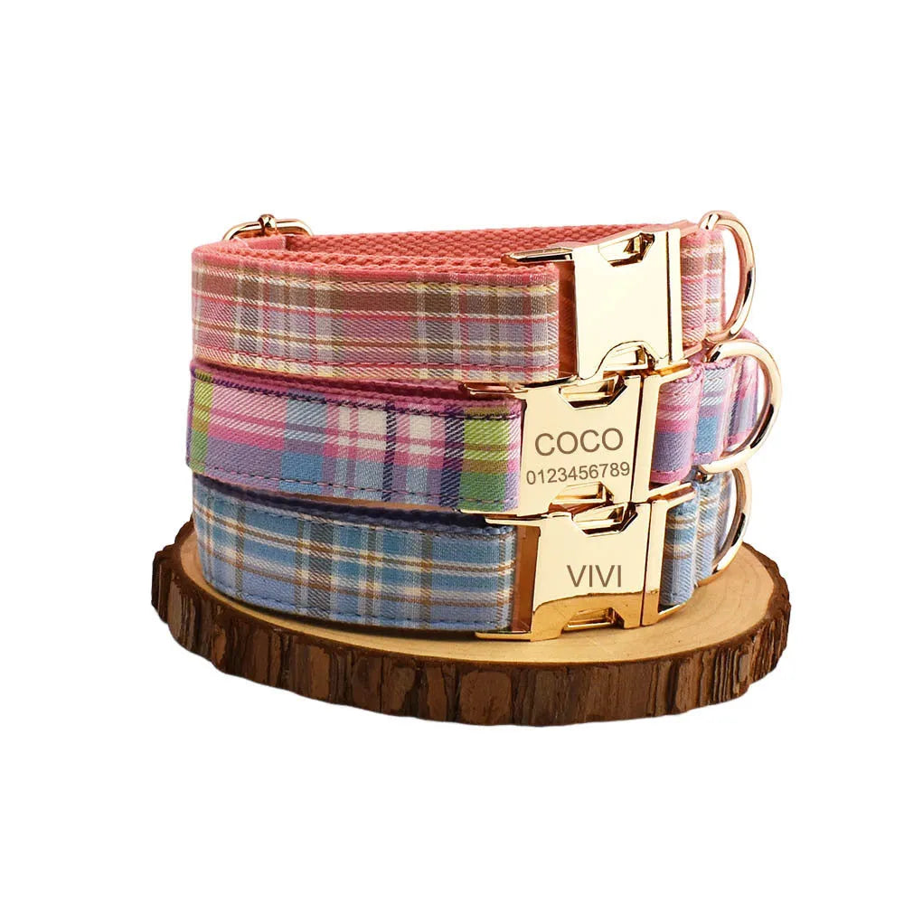 Cloth dog collar and matching lead set with a red bow and a matching dog vest laid out flat.
