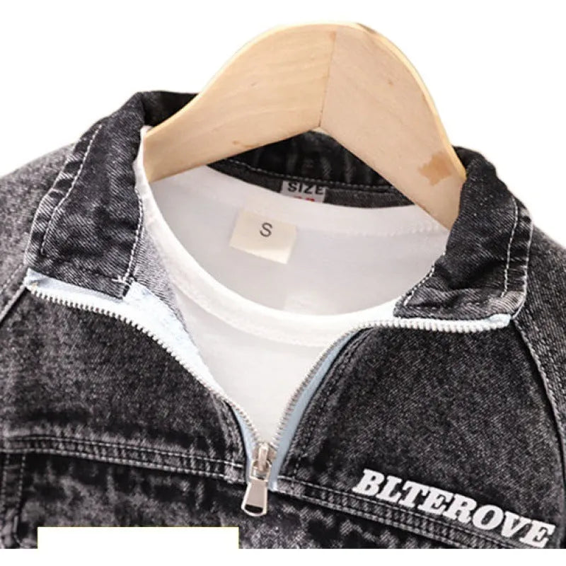 Boys' black denim two-piece suit with long sleeves, shown on a hanger.