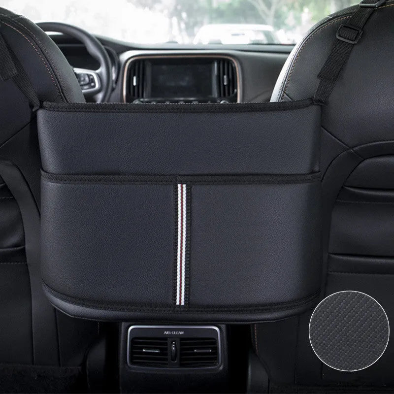 Black leather car seat storage bag with carbon fibre pattern, shown fitted in a car seat net pocket.