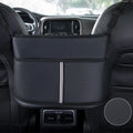Black leather car seat storage bag with carbon fibre pattern, shown fitted in a car seat net pocket.