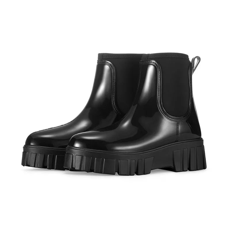 Low tube PVC rain boots in apricot colour with a non-slip sole and flat heel.