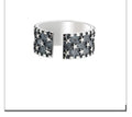 Adjustable opening sterling silver ring with a multi five-pointed star geometric pattern.