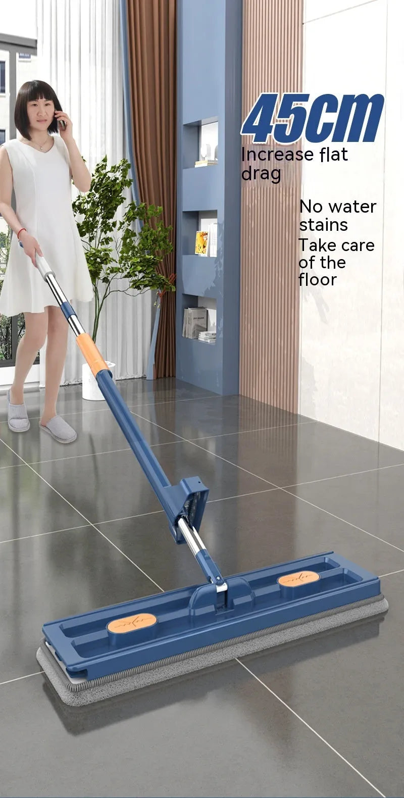 Large flat mop with long stainless steel handle and blue cleaning cloth on a hard floor