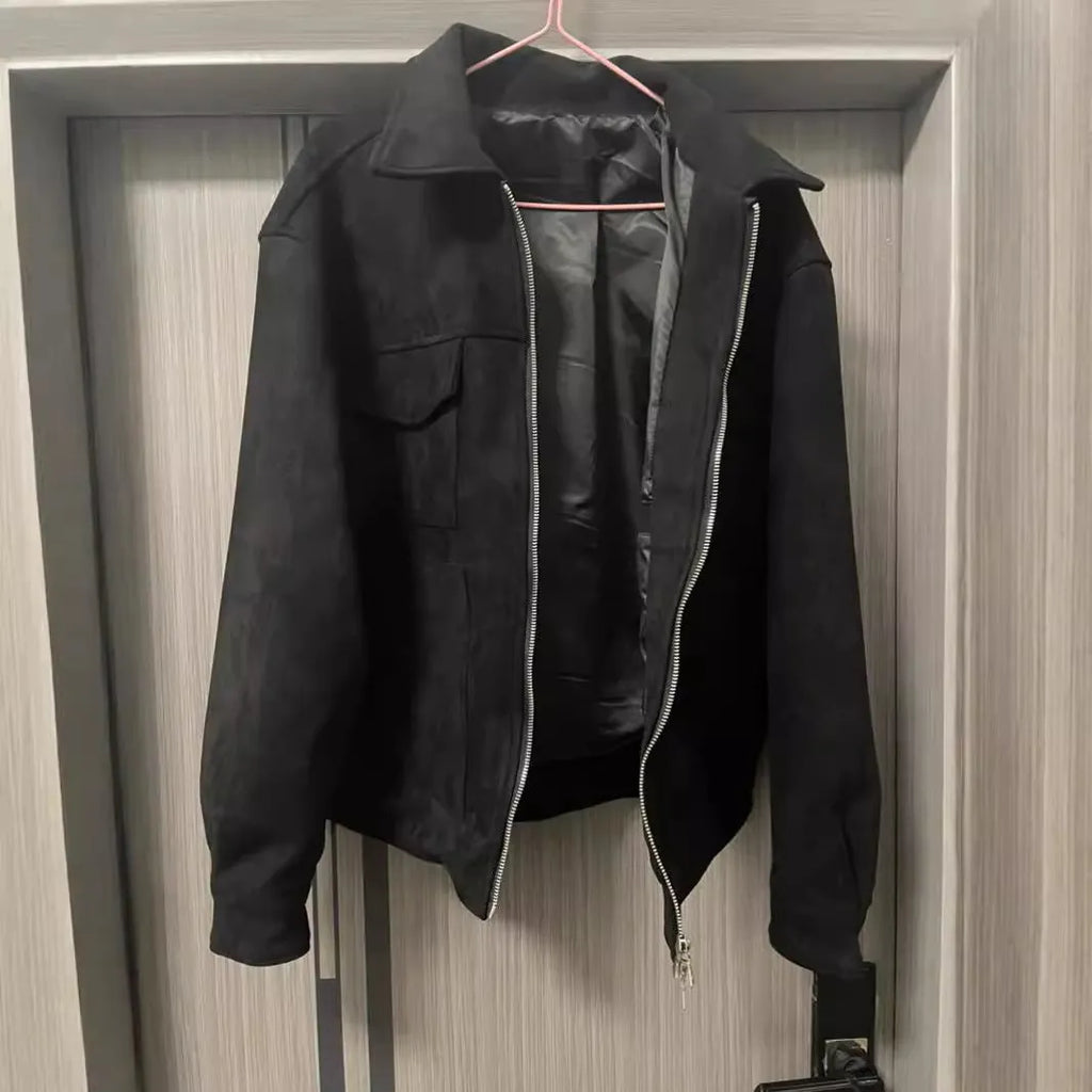 Slim fit camel coloured jacket with zipper pockets on a model.