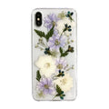 Soft blue and purple dried floral bouquet design on a transparent TPU case for an iPhone.