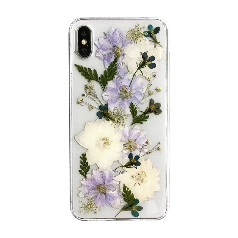 Soft blue and purple dried floral bouquet design on a transparent TPU case for an iPhone.
