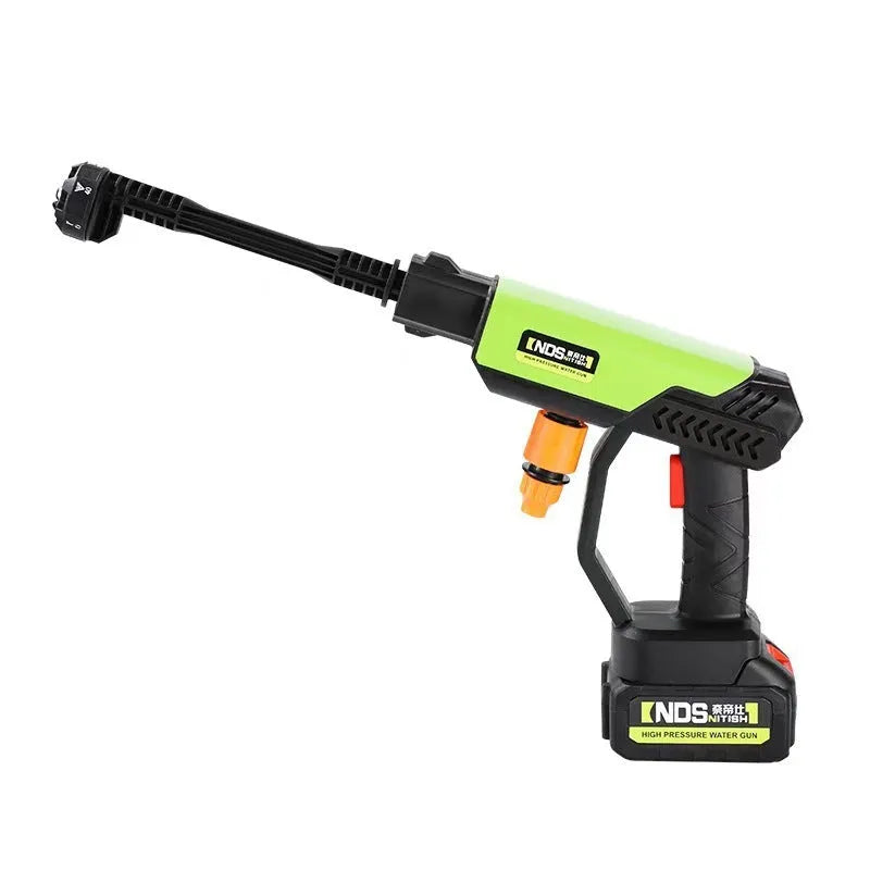 Green cordless high-pressure water gun with metal nozzle, extension rod, foam pot, and accessories on a white background.