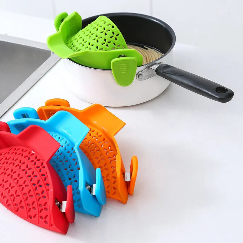 Silicone pot drain stopper kitchen gadget in five colour options on kitchen counter