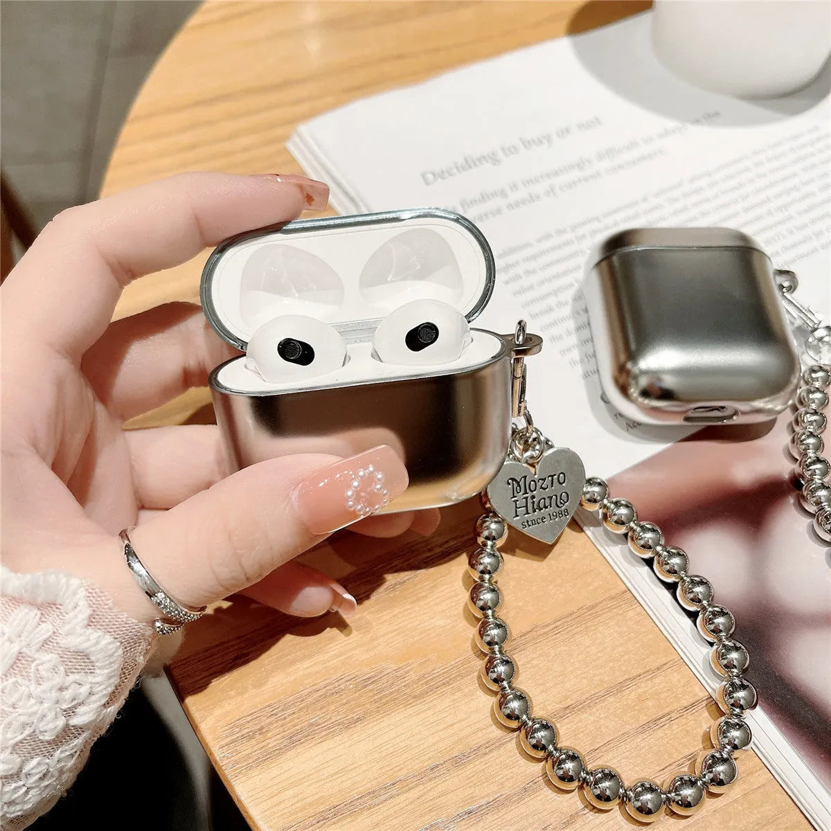 Matte plating AirPods protective case with electroplated bracelet-style details on TPU material