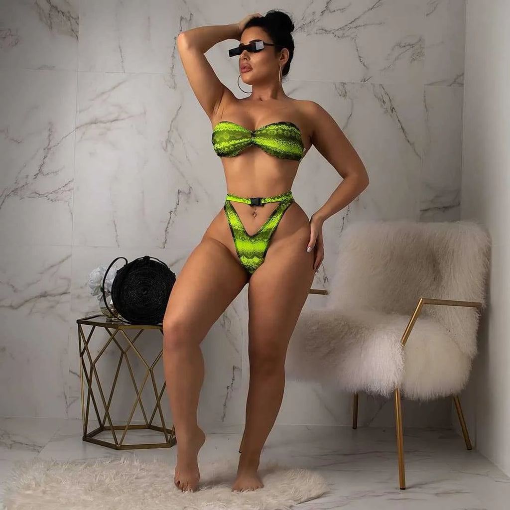 Women's purple snakeskin print bikini set with sleeveless top and shorts on a mannequin.