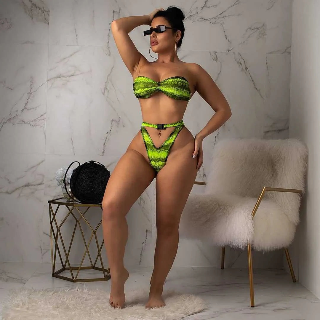 Women's purple snakeskin print bikini set with sleeveless top and shorts on a mannequin.