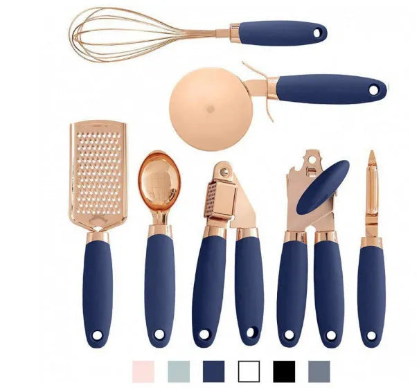 Seven-piece stainless steel kitchen tool set with copper handles on a cutlery rack, in rose gold colour.
