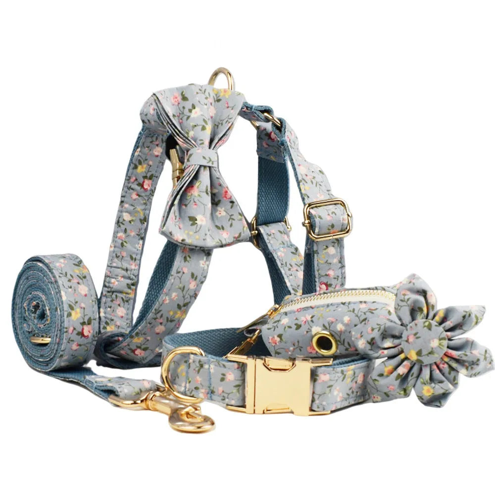 Blue floral polyester cotton dog collar with matching leash, vest, and bow tie accessories