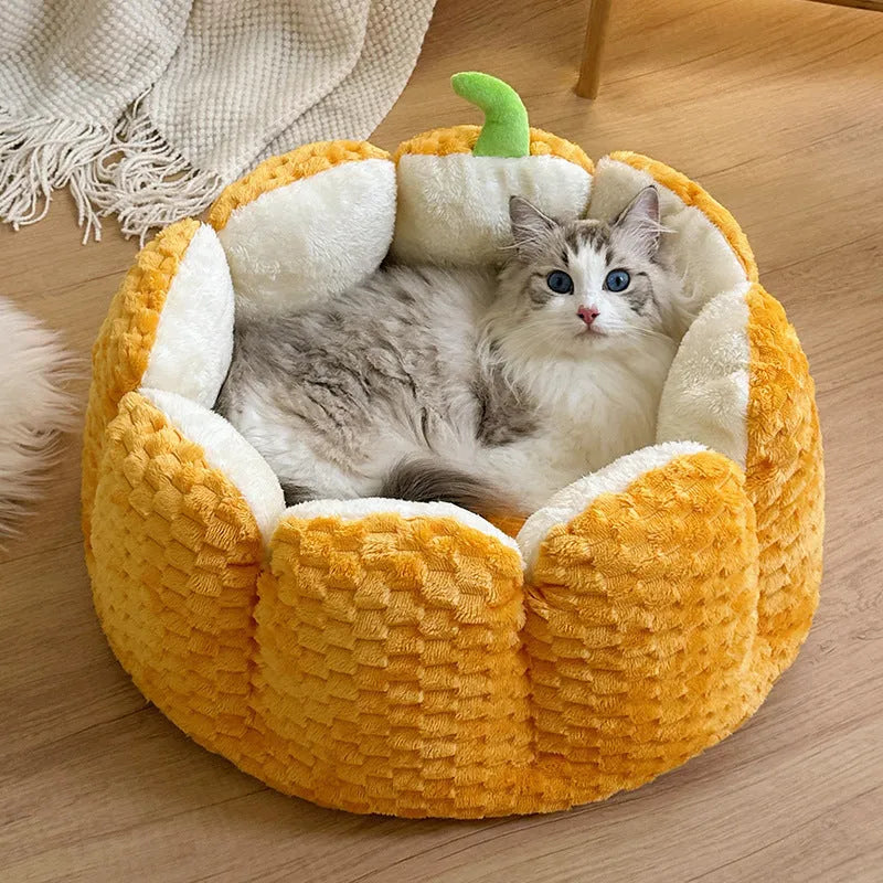 Orange pumpkin-shaped pet bed for cats and small dogs with raised sides and cotton filling
