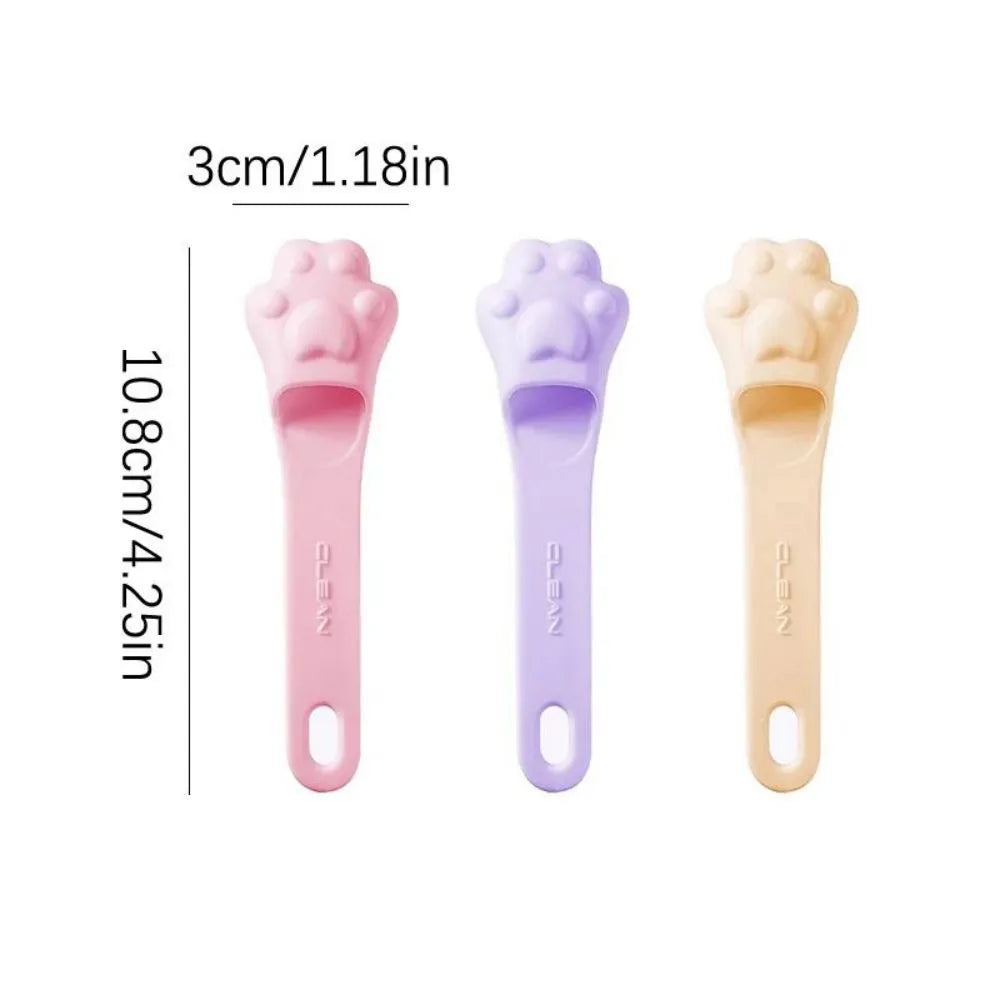 Pink silicone finger toothbrush for dogs and cats with soft nubby bristles.