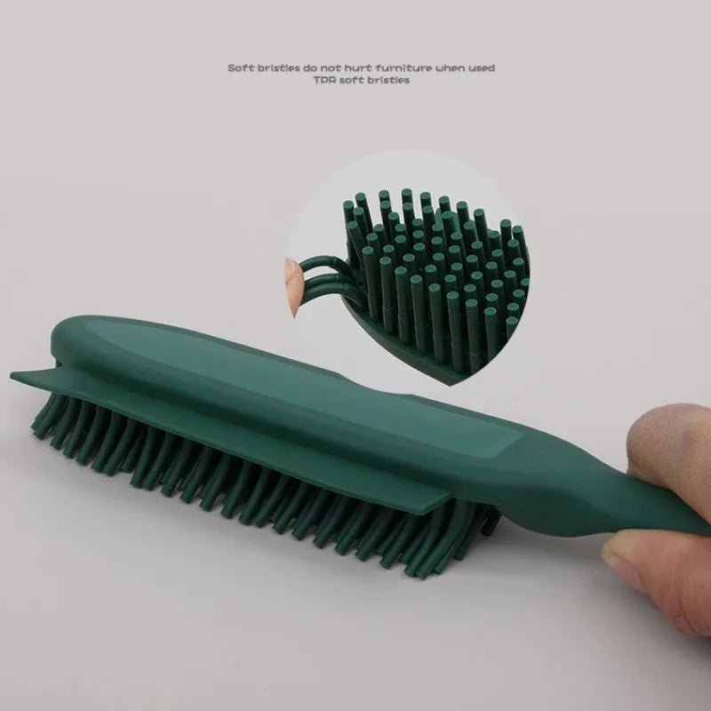 Green and pink dog brush with rubber bristles and pet hair remover function