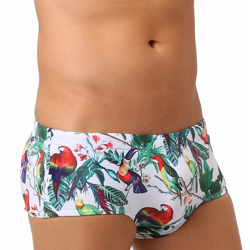 Men's swimming trunks with flower-bird print pattern in nylon fabric showing briefs style