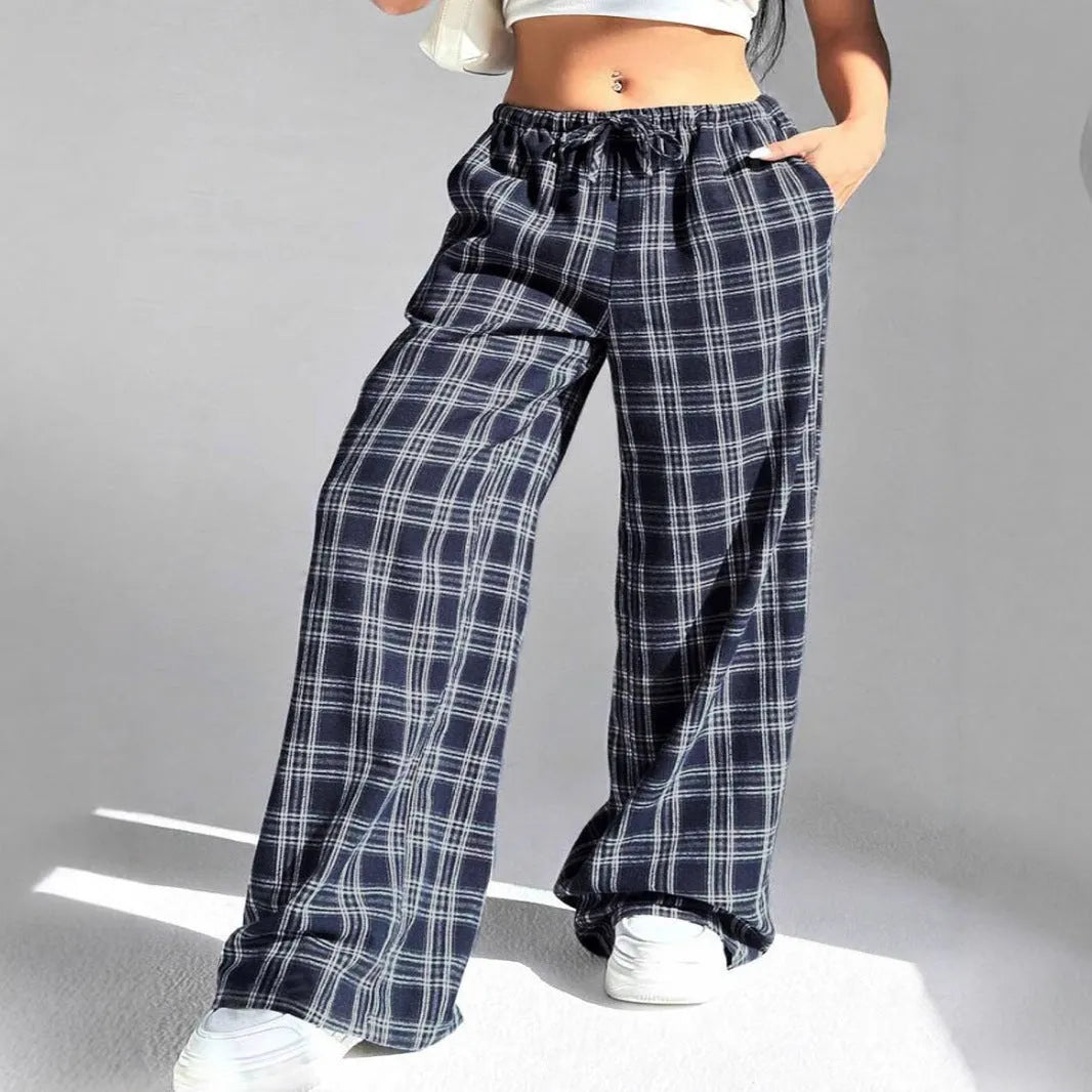 Women's plaid trousers with drawstring waist and multiple pockets in blue or red colours