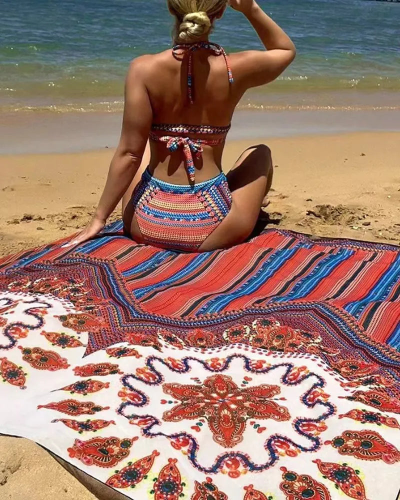 Women's three-piece swimsuit set showing high-waisted bikini bottom, cutout blouse, and matching cover-up coat in a printed design.