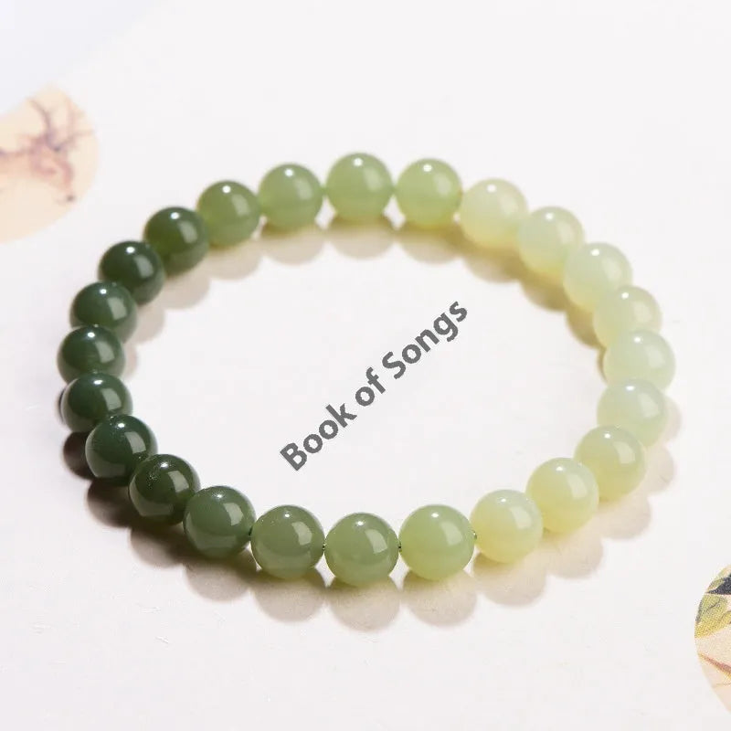 Natural clear water Hetian jade ball bracelet showing gradient jade beads in round or barrel shapes