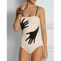 Women's solid colour one-piece bikini swimsuit on a mannequin, with an optional gauze skirt variant.
