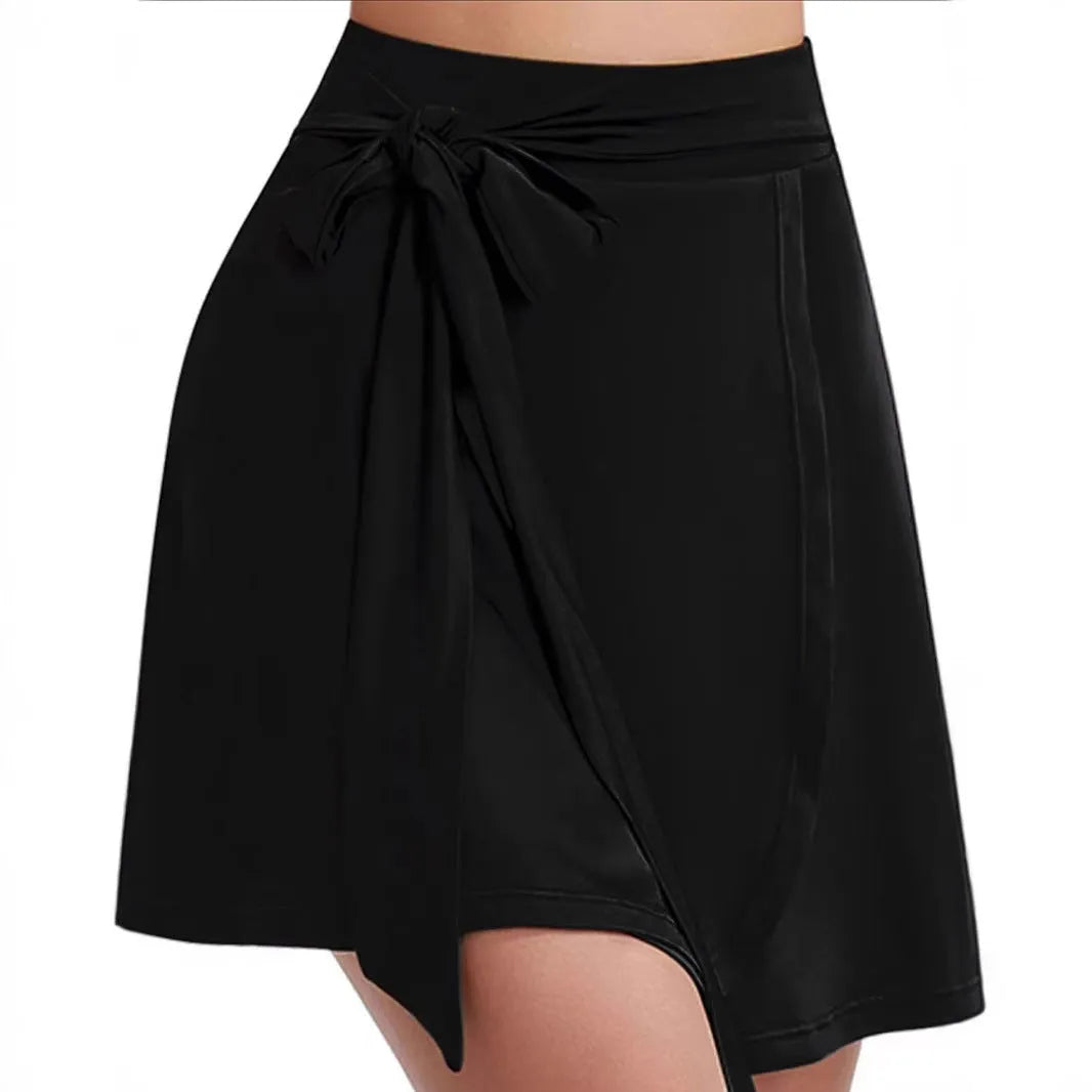 Black unisex thigh-length sports skirt culottes with built-in shorts and high waist design.