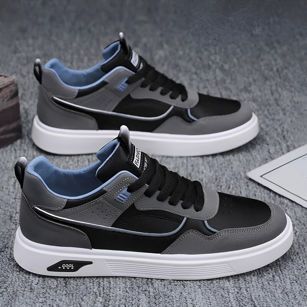 Men's solid-colour canvas board shoes with leather stitching and mesh lining.