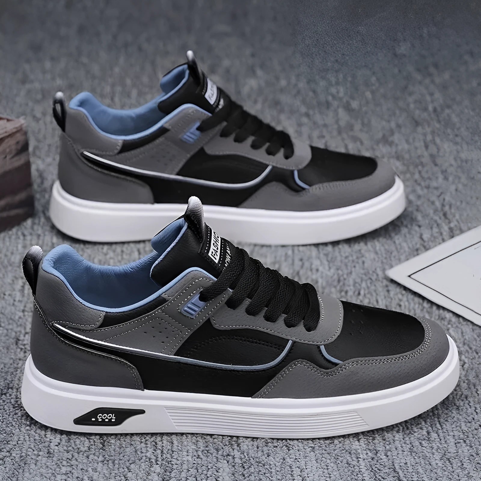 Men's solid-colour canvas board shoes with leather stitching and mesh lining.