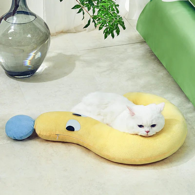 Blue rectangular pet pillow for cats and dogs on a floor, showing its 62cm by 39cm size.