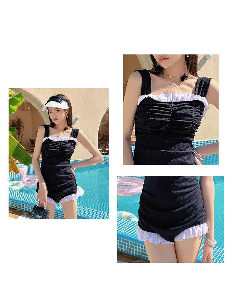 Women's solid colour one-piece swimsuit with suspender straps in black, pink, or green.