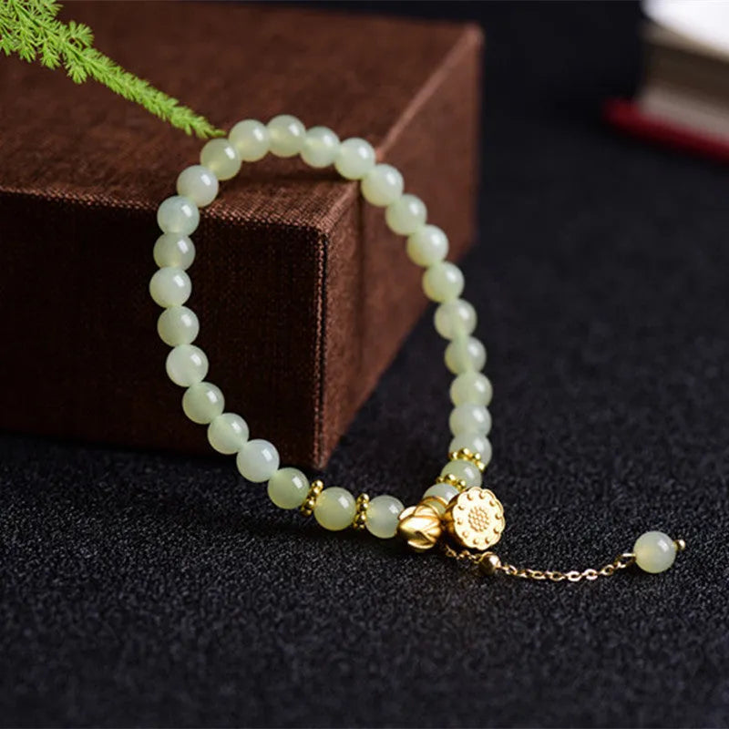Natural Hetian jade bracelet with 6mm lotus beads and fu character element