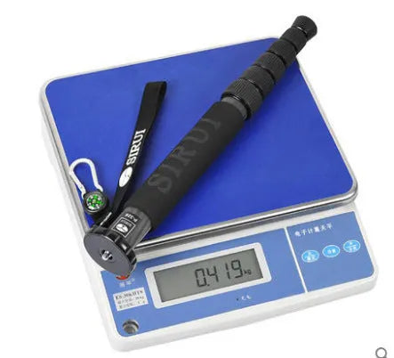Black carbon fibre telescopic monopod for DSLR cameras extended to full height