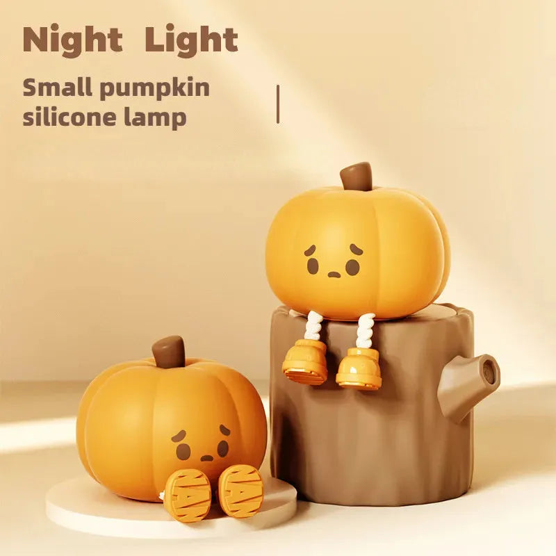 Orange pumpkin-shaped silicone night light with soft glowing illumination