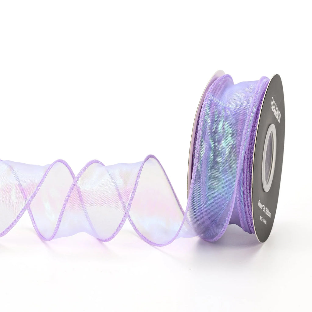 Roll of colourful fishtail yarn mesh ribbon with wave texture, shown in 4cm width.