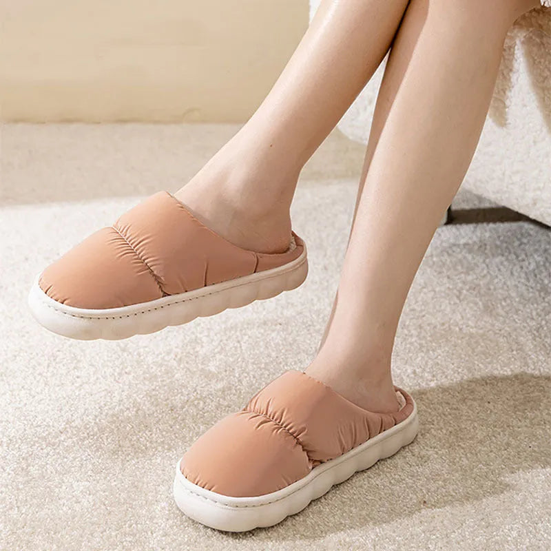 Blue down cotton slippers with artificial leather uppers, thick rubber soles, and plush lining for indoor winter wear.