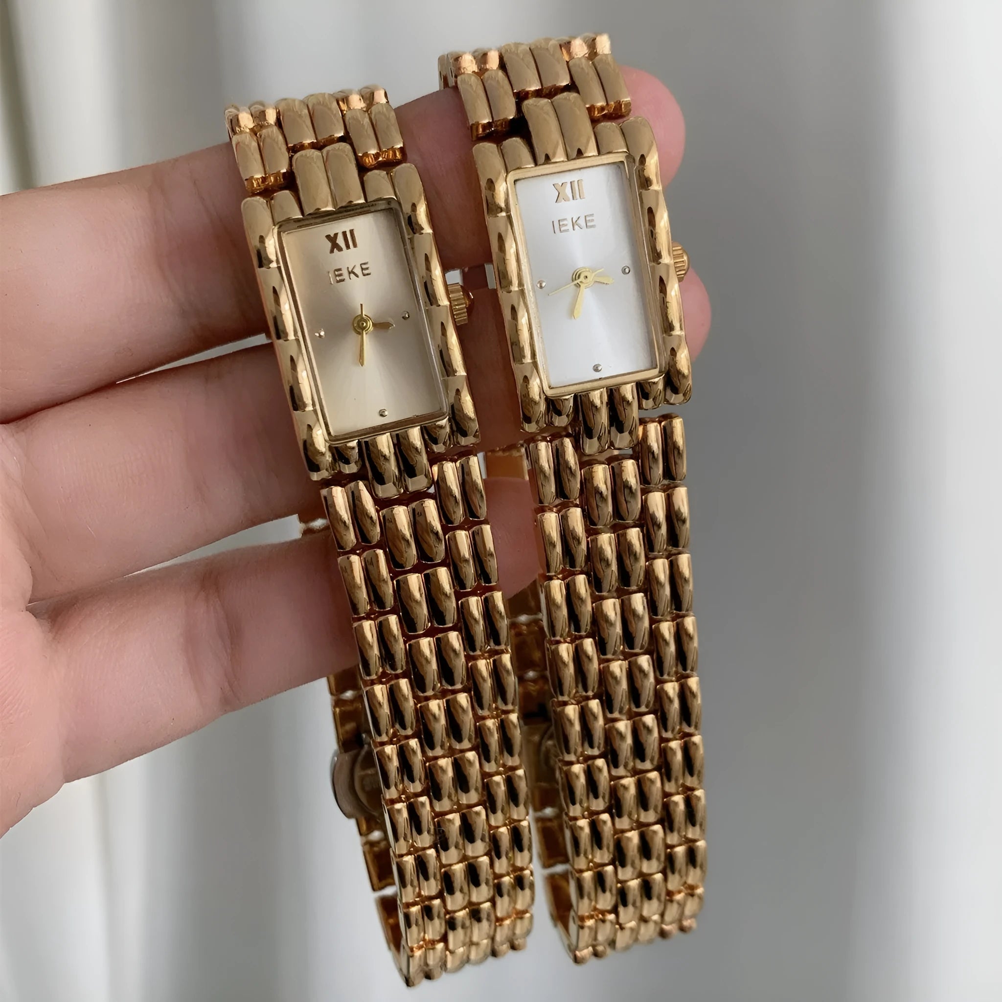 Bracelet-style silver and gold women's Ins watch showing 15mm dial and butterfly clasp.