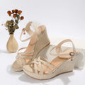 Women's wedge sandals with fish mouth toe and cloth upper in black and beige