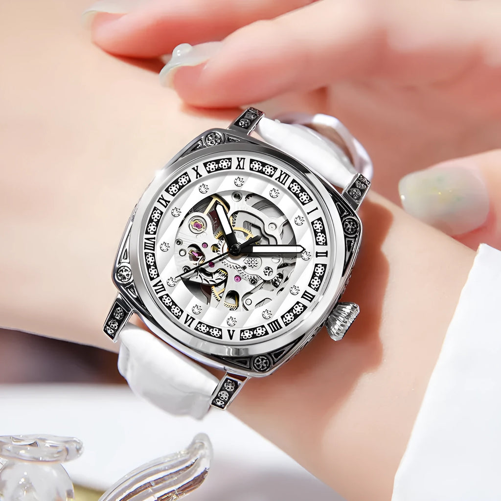 Mechanical wristwatch with luminous hands and a leather strap, shown in a choice of colours.