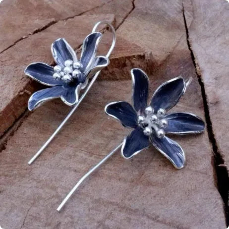Purple flower-shaped alloy earrings with electroplated finish and butterfly back fastenings