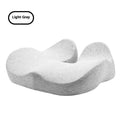Solid colour memory foam office chair cushion in light grey on a chair.