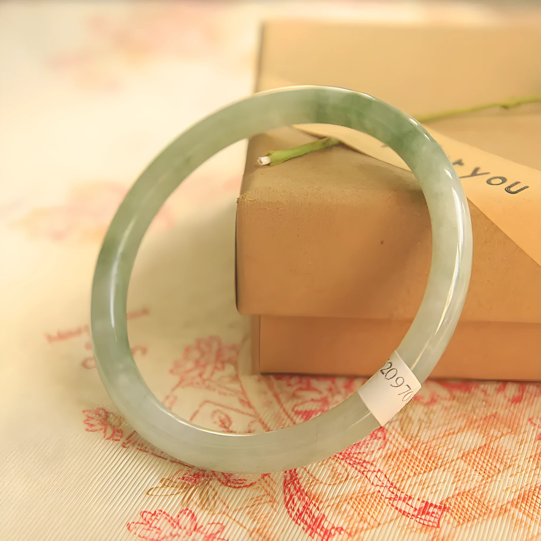 Green jade waxy Chinese style bracelet with geometric pattern showing 10mm width and adjustable sizing