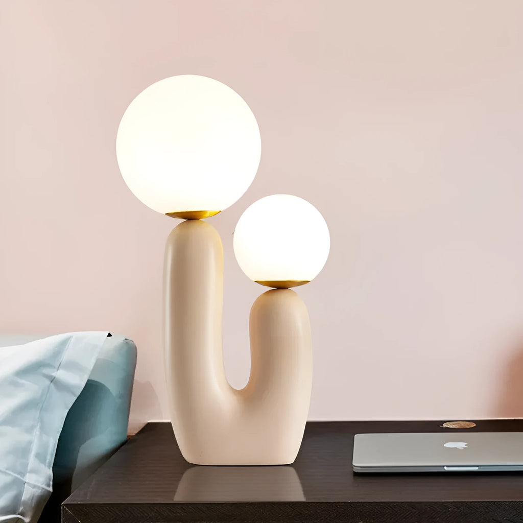 Pink double-head resin table lamp with glass shades on a bedside table, 49cm height