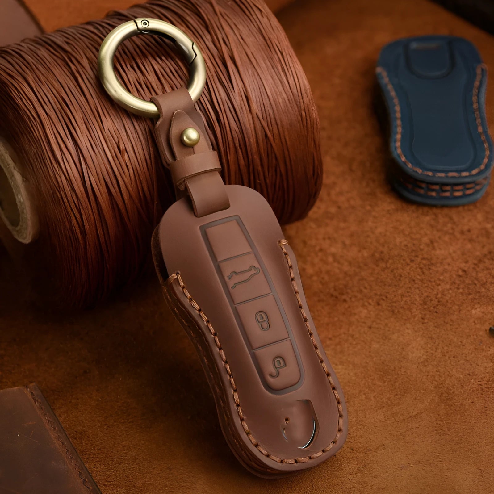 Porsche key cover made from brown cowhide leather with retro bag buckle design