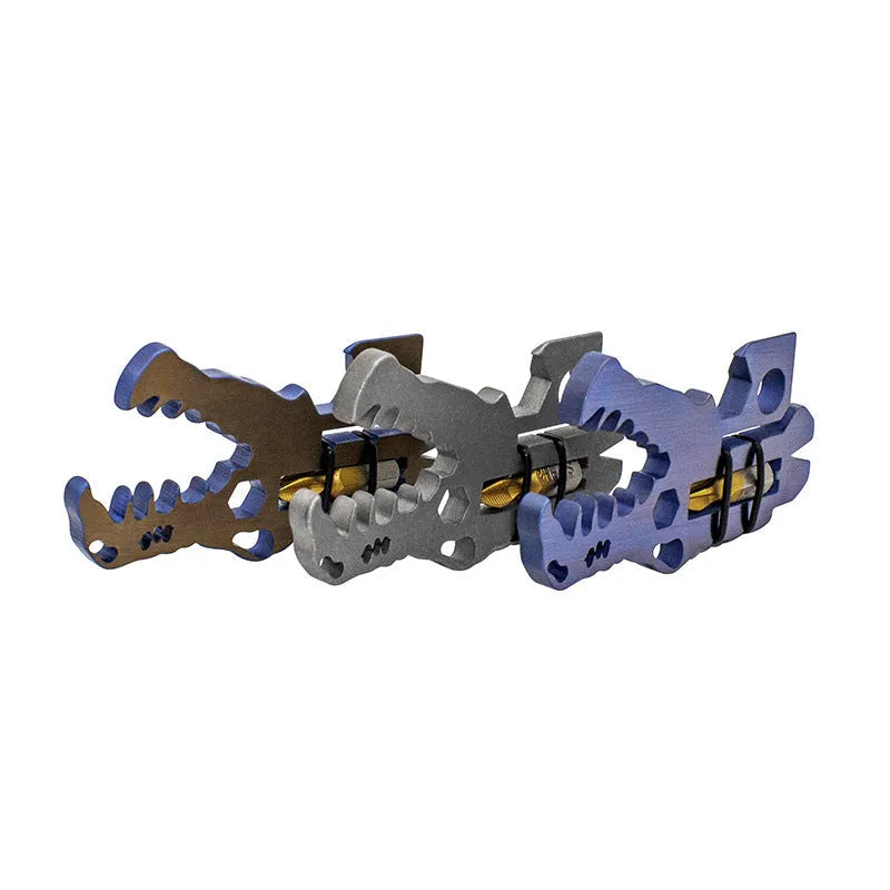 Dinosaur head tool in TC4 titanium, 78 x 42 x 5mm, 34g, shown in grey blue or copper for outdoor and home use