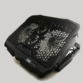 Black laptop cooling stand with copper heat sink, four heat pipes, and variable speed fan for notebook computers