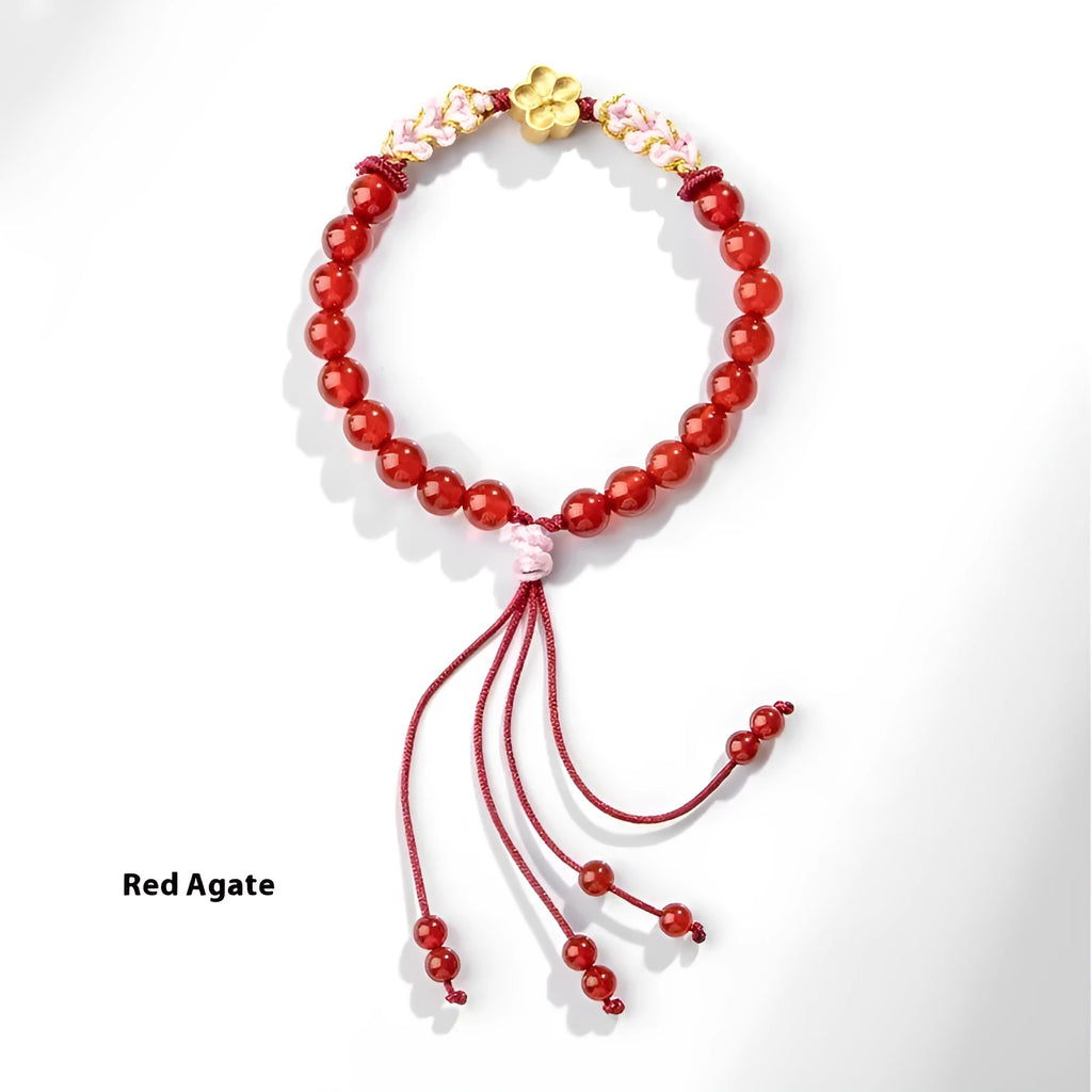 Hand-woven red rope bracelet with diamond-shaped crystal peach blossom charm in Chinese style